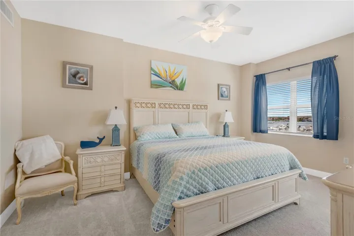 Primary Bedroom with windows overlooking the Marina