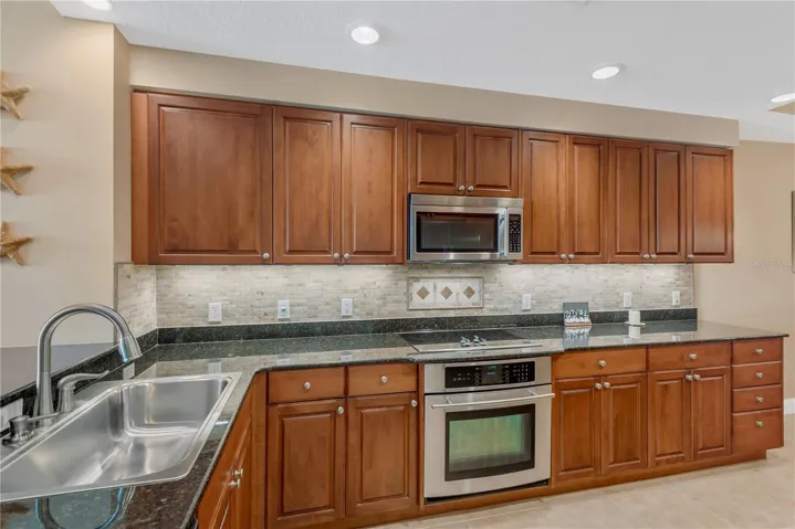 Spacious Kitchen with Roll-out shelving in all lower cabinets and under cabinet lighting.