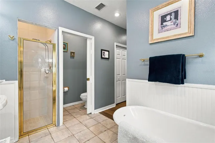 View of shower and water closet.