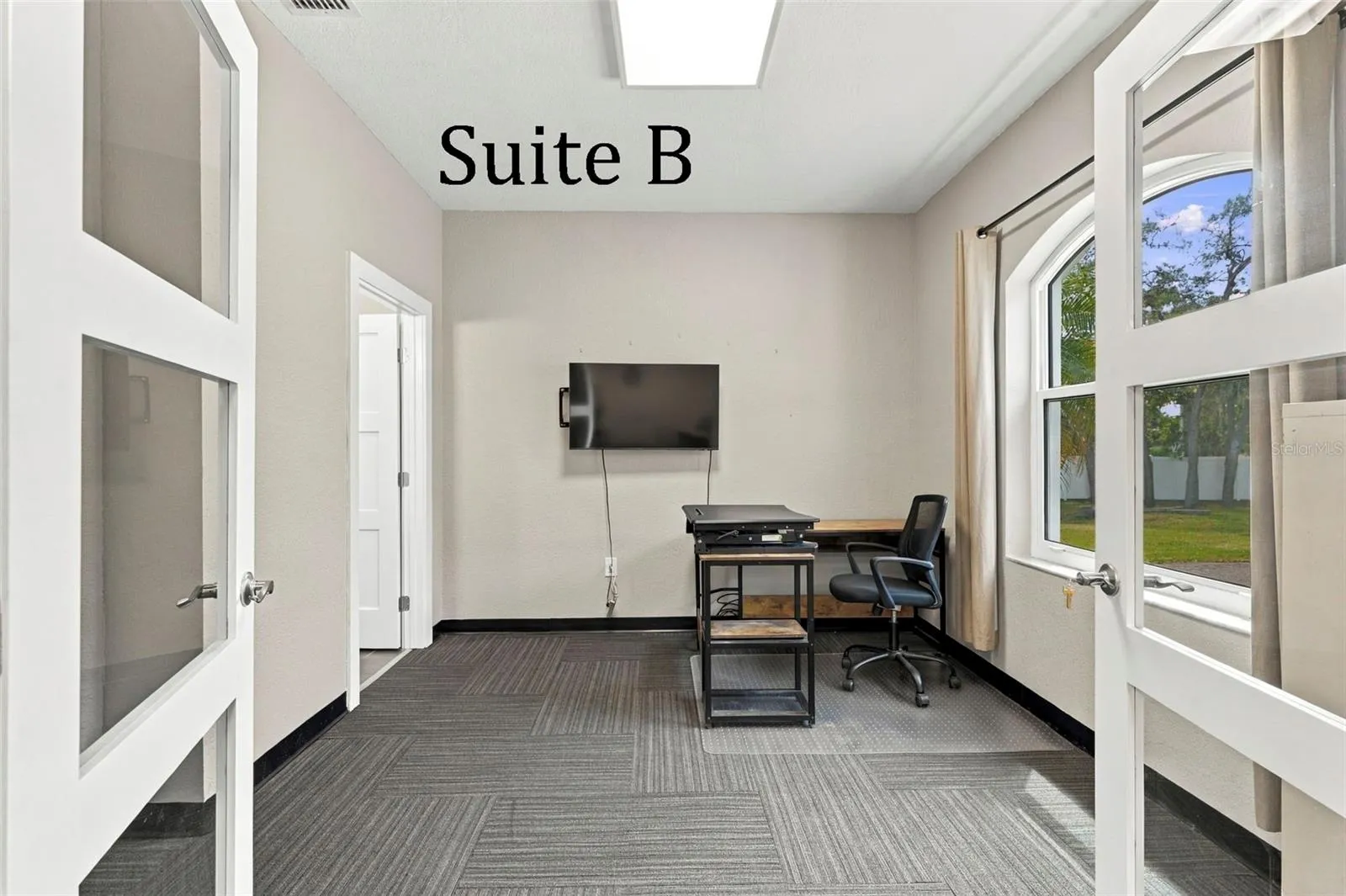 Double Glass Doors into Suite B, with Private Full Bathroom, Window to the Front of the Office, located by the Lobby