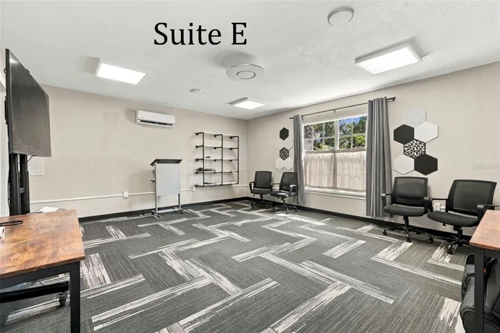 Suite E has a private entrance, large window overlooking the landscaping, a private restroom and has access to the Covered Patio Break Area