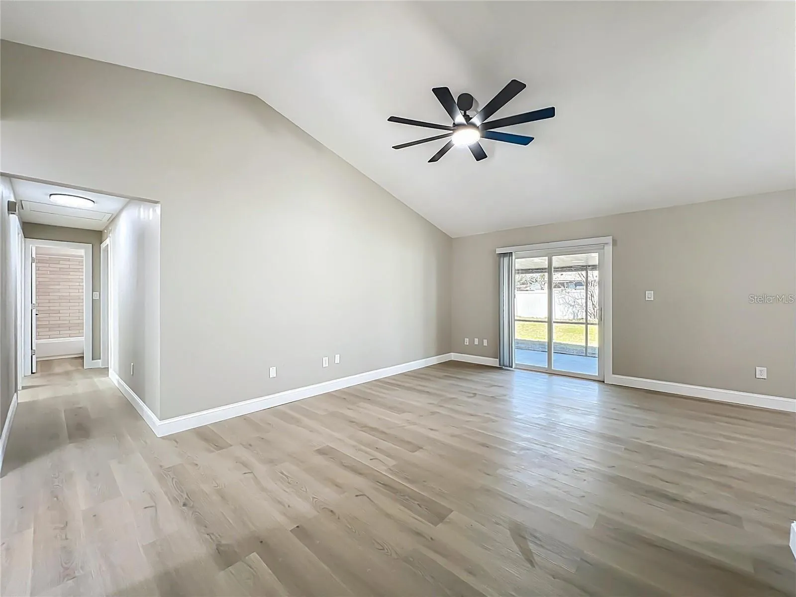 View from living room, sliding doors toward breezeway.