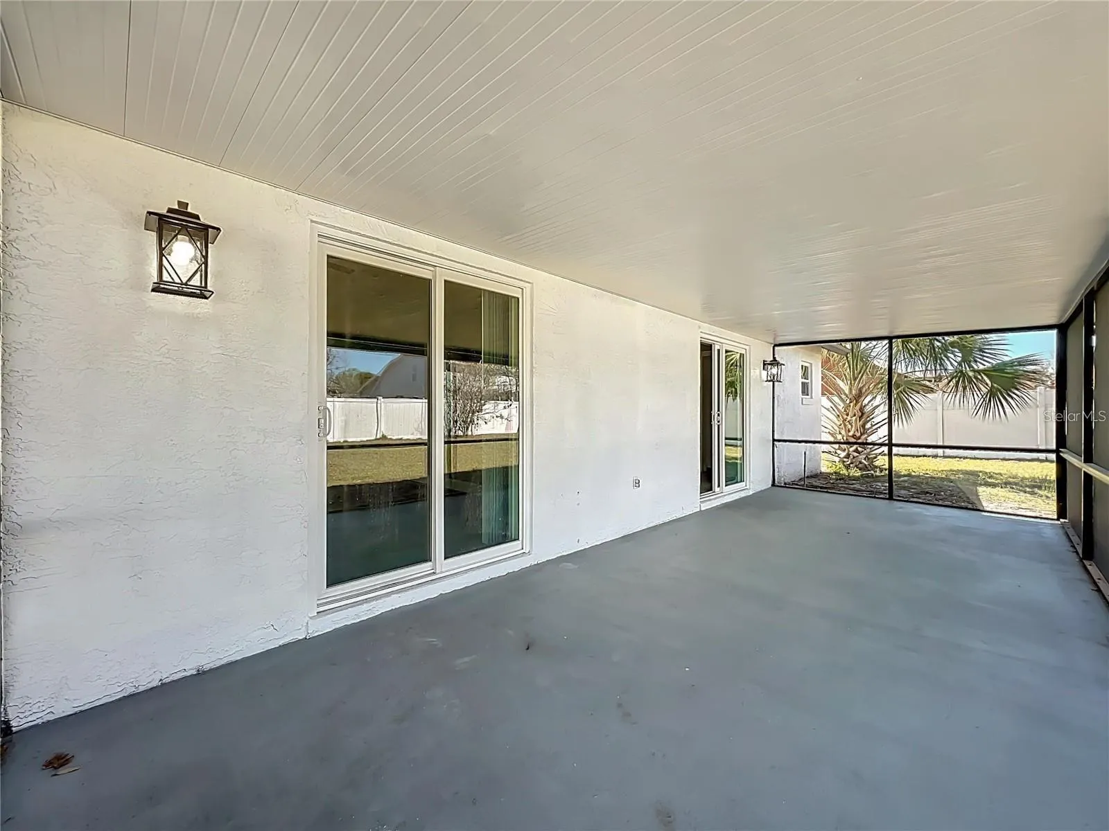 View of sliding doors, screened in patio.