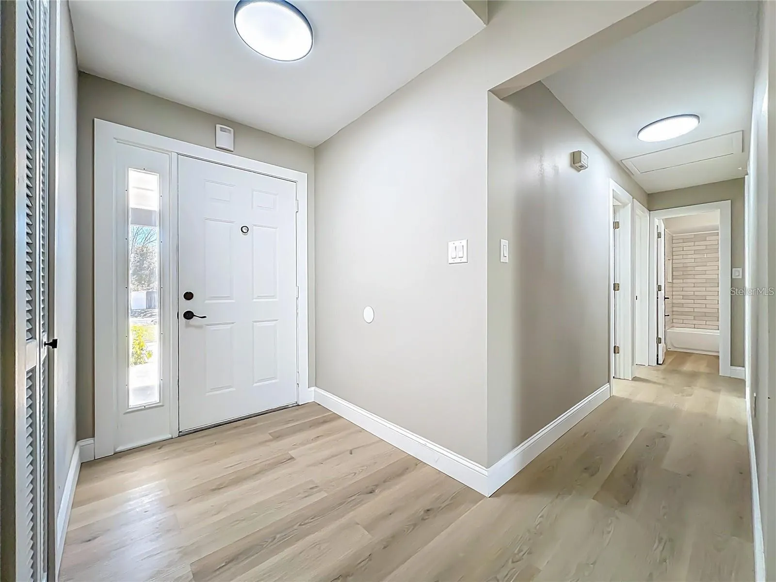 View of entrance and breezeway toward bedrooms.