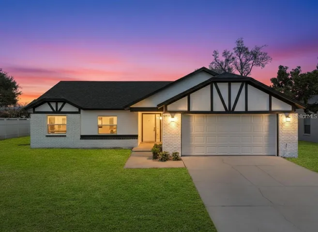 Evening view of property.