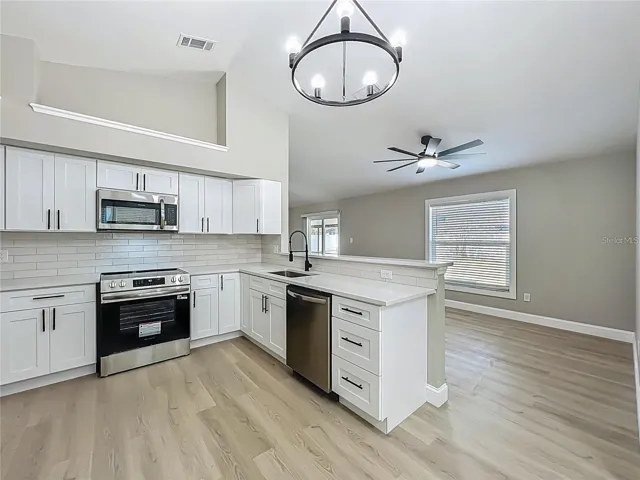 View from dinette area toward kitchen and dining room area.