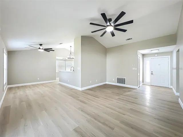 View of entrance, living room and dining area.
