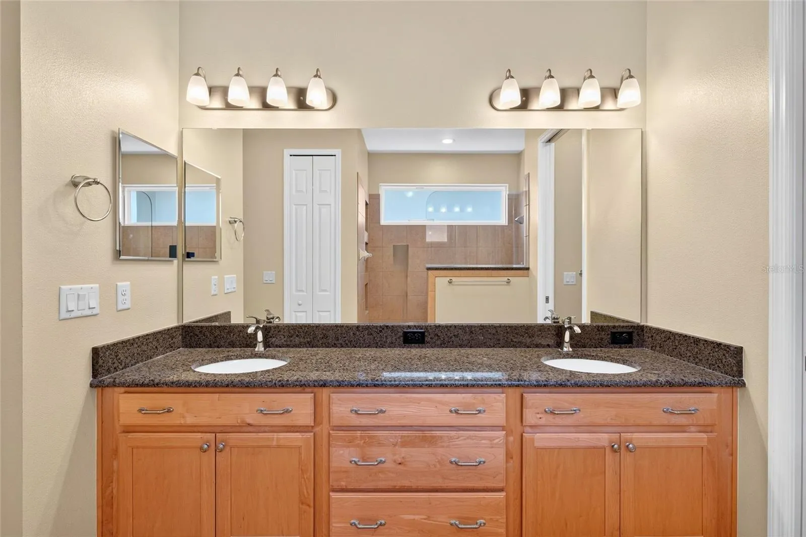 Large, walk-in shower.Dual vanity sinks.Linen closet.