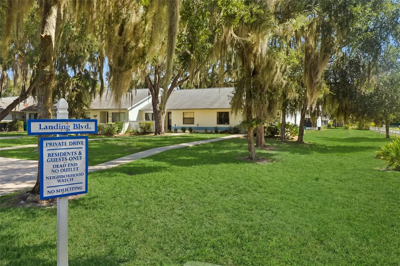 View of community signage and lot view when entering neighborhood