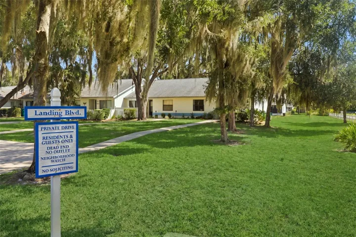 View of community signage and lot view when entering neighborhood