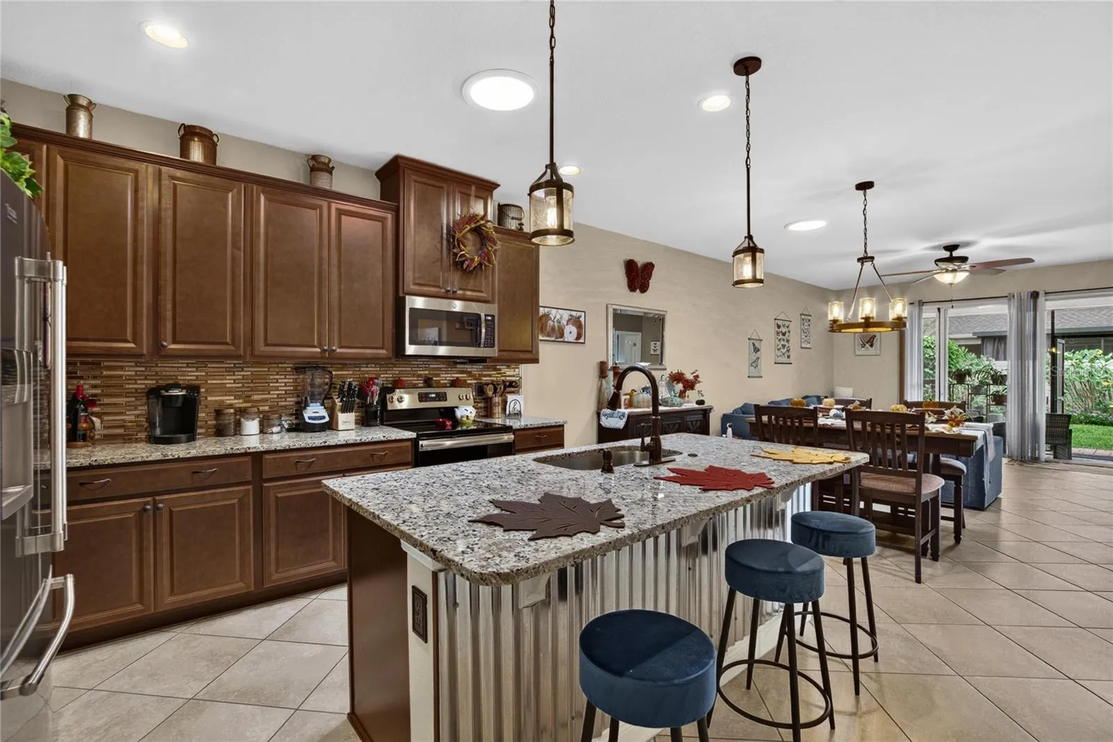 More than builder basic: upgraded pendant lighting, cabinet hardware, a full size sink and pull down faucet elevate the kitchen