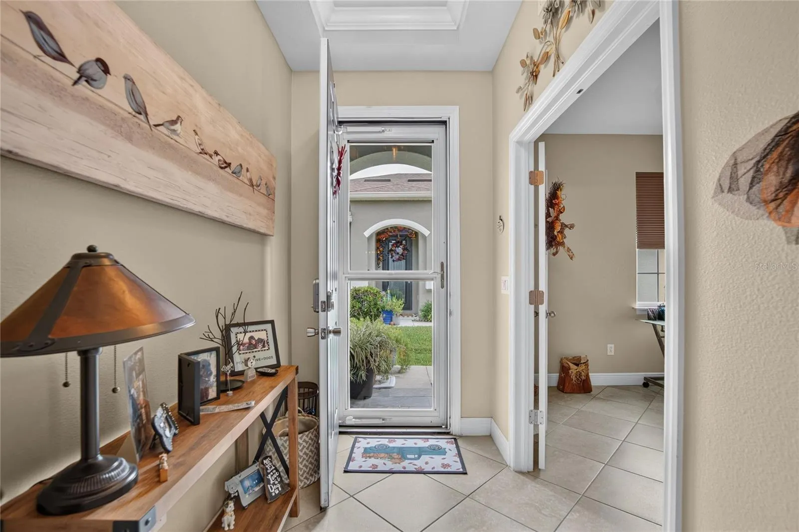 A bright, welcoming entry creates a clear path into the home's open living spaces