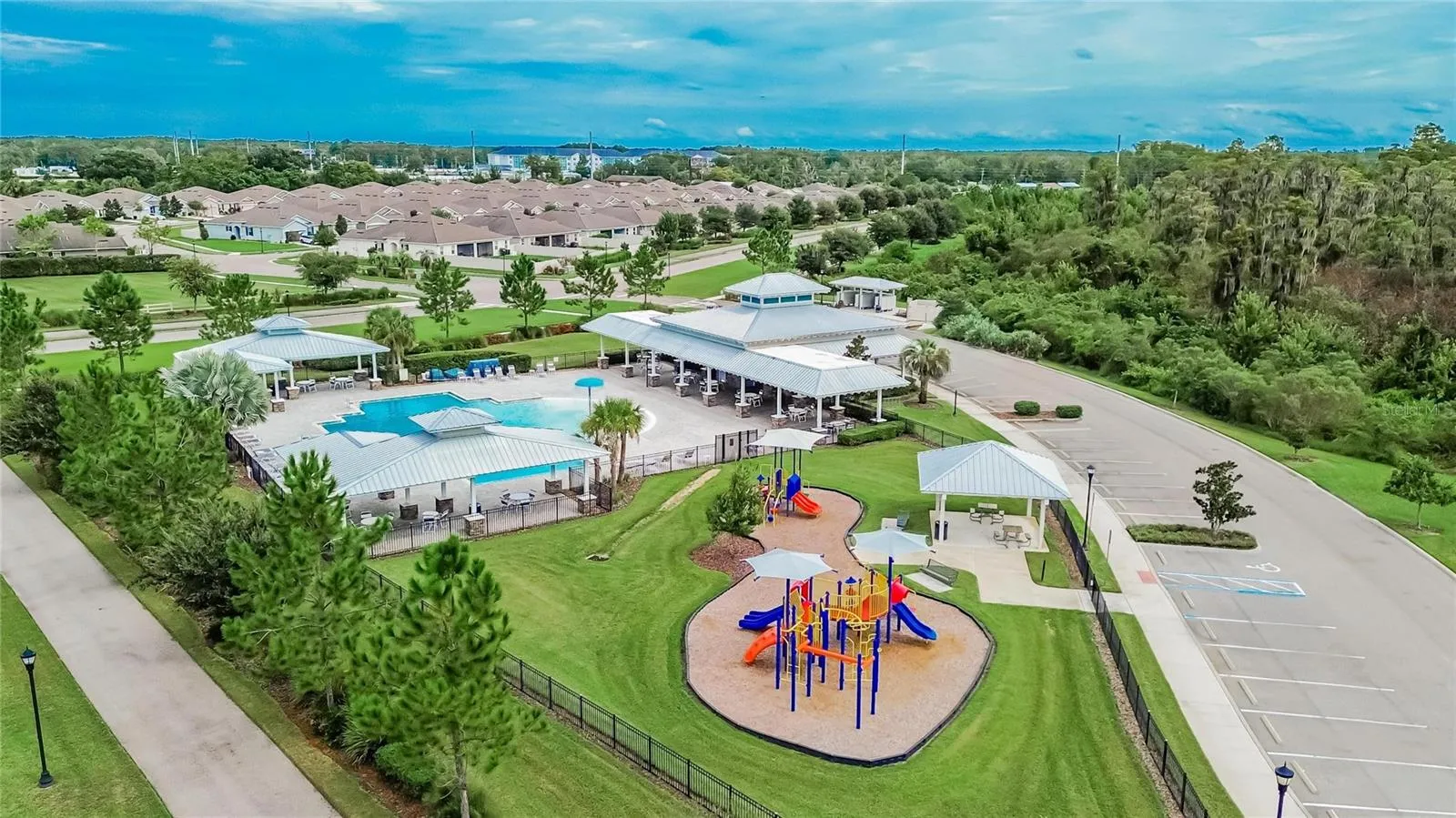 A bird's eye view reveals the community pool, playground and amenity center all in one convenient setting
