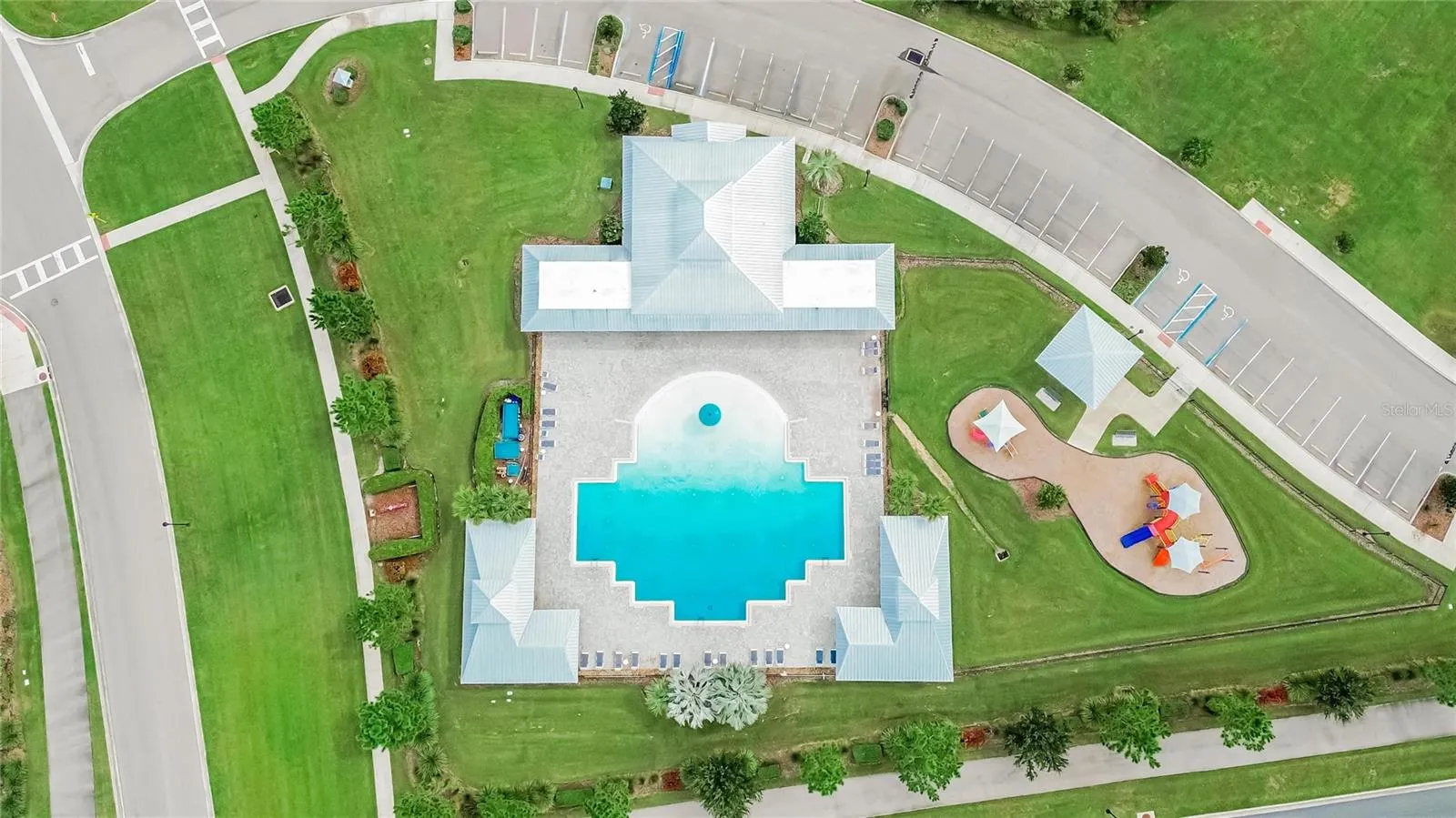 From above, the pool, playground and community gathering areas come together in one inviting recreation hub