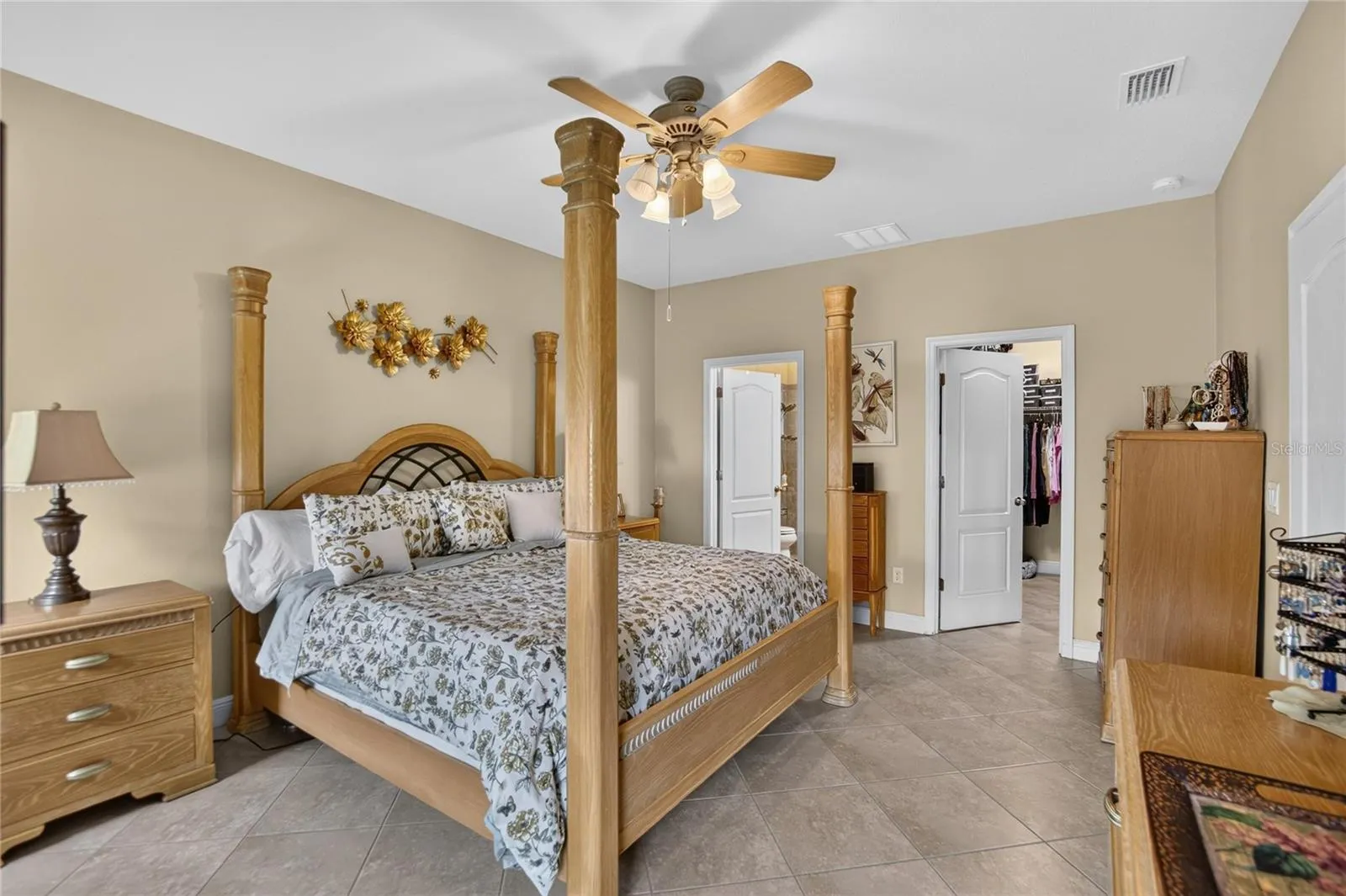 Easy care tile continues into the primary suite for a clean, cohesive and completely carpet free finish