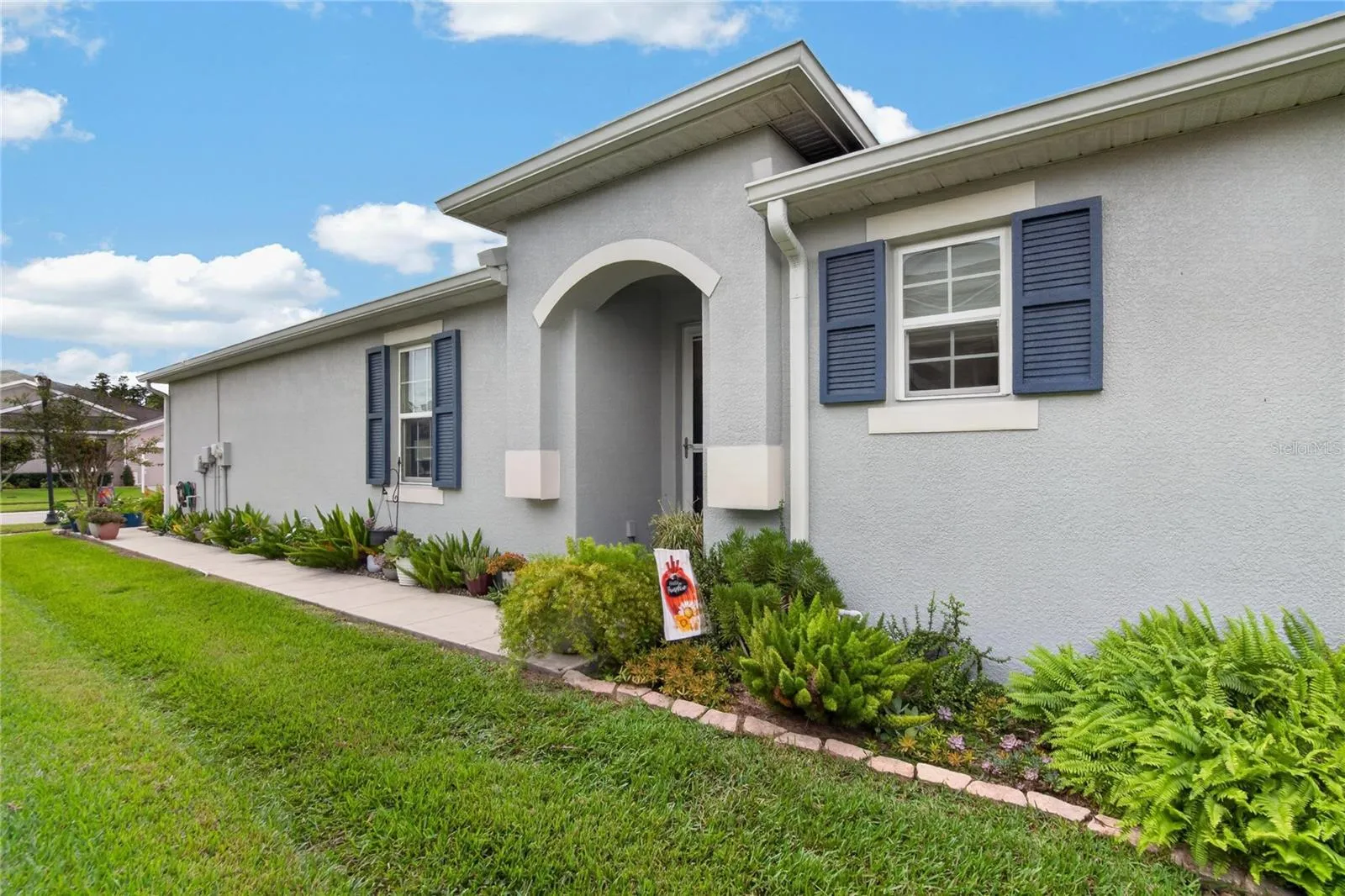 Fresh exterior paint and carefully maintained landscaping create a polished, move in ready first impression