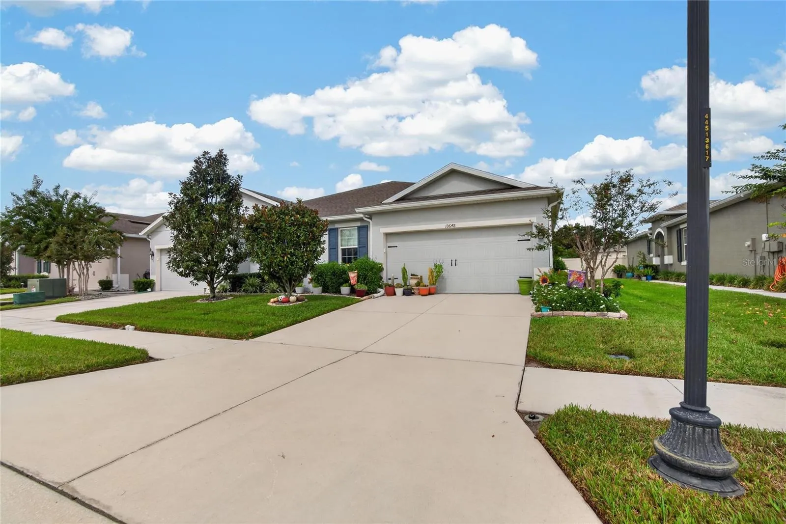 This broader approach shows the home’s curb appeal within its tidy Cypress Preserve streetscape
