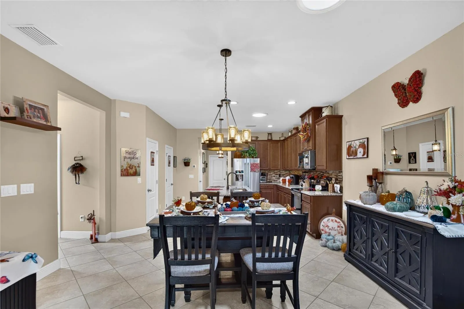 The dining area sits comfortably between the kitchen and living room, making meals and conversation feel effortless