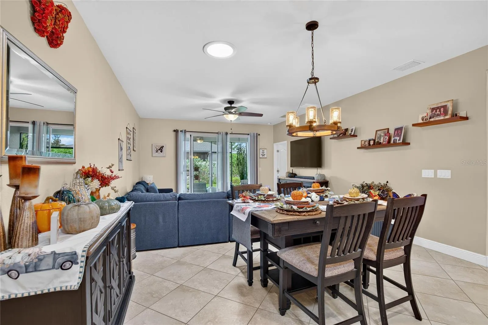 Dining and living areas share one flexible, light filled space designed for both quiet evenings and lively gatherings
