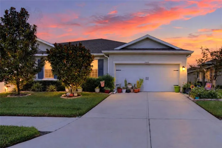 Warm evening light gives the front exterior an inviting glow and a welcoming sense of home