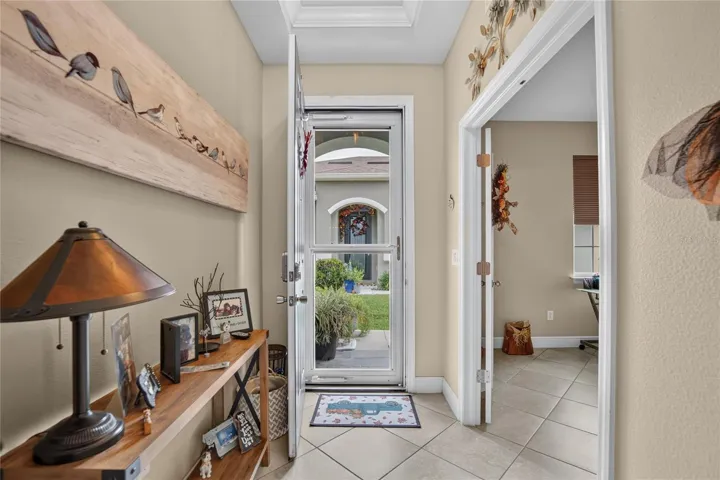 A bright, welcoming entry creates a clear path into the home's open living spaces