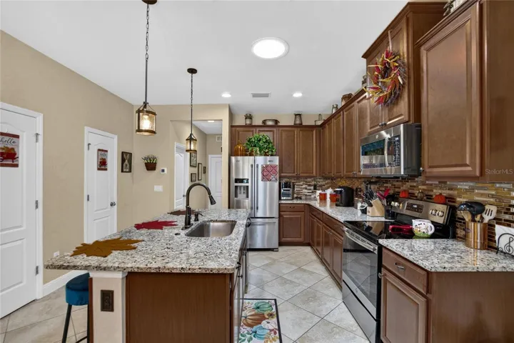 Upgraded kitchen details add personality and everyday function well beyond the original builder selections