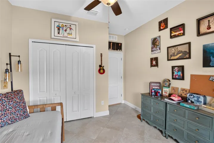Double door closet storage helps keep the third bedroom organized without sacrificing usable floor space