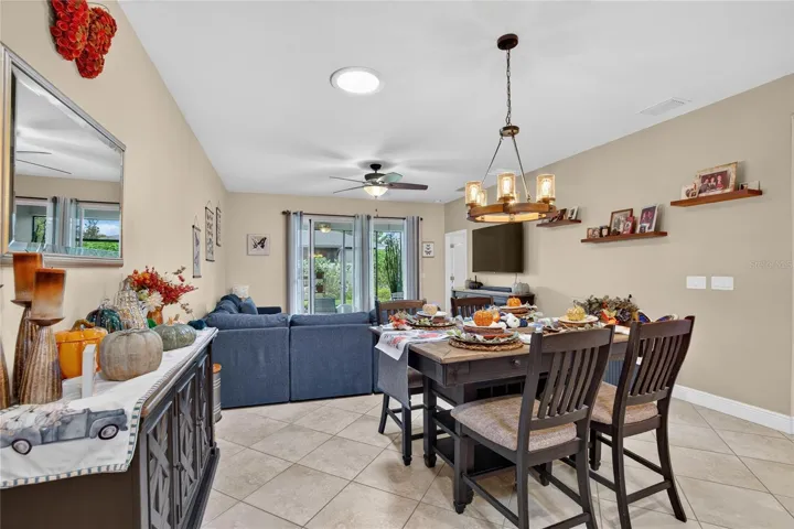 Dining and living areas share one flexible, light filled space designed for both quiet evenings and lively gatherings
