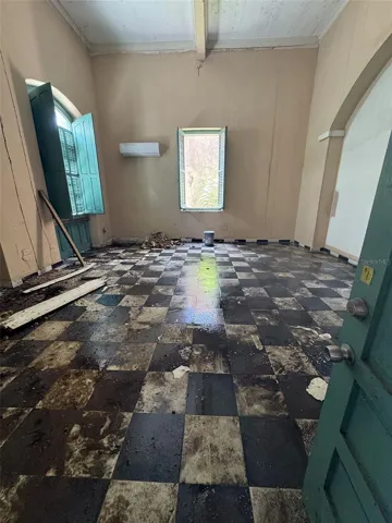 Second-floor salon with original tile floor