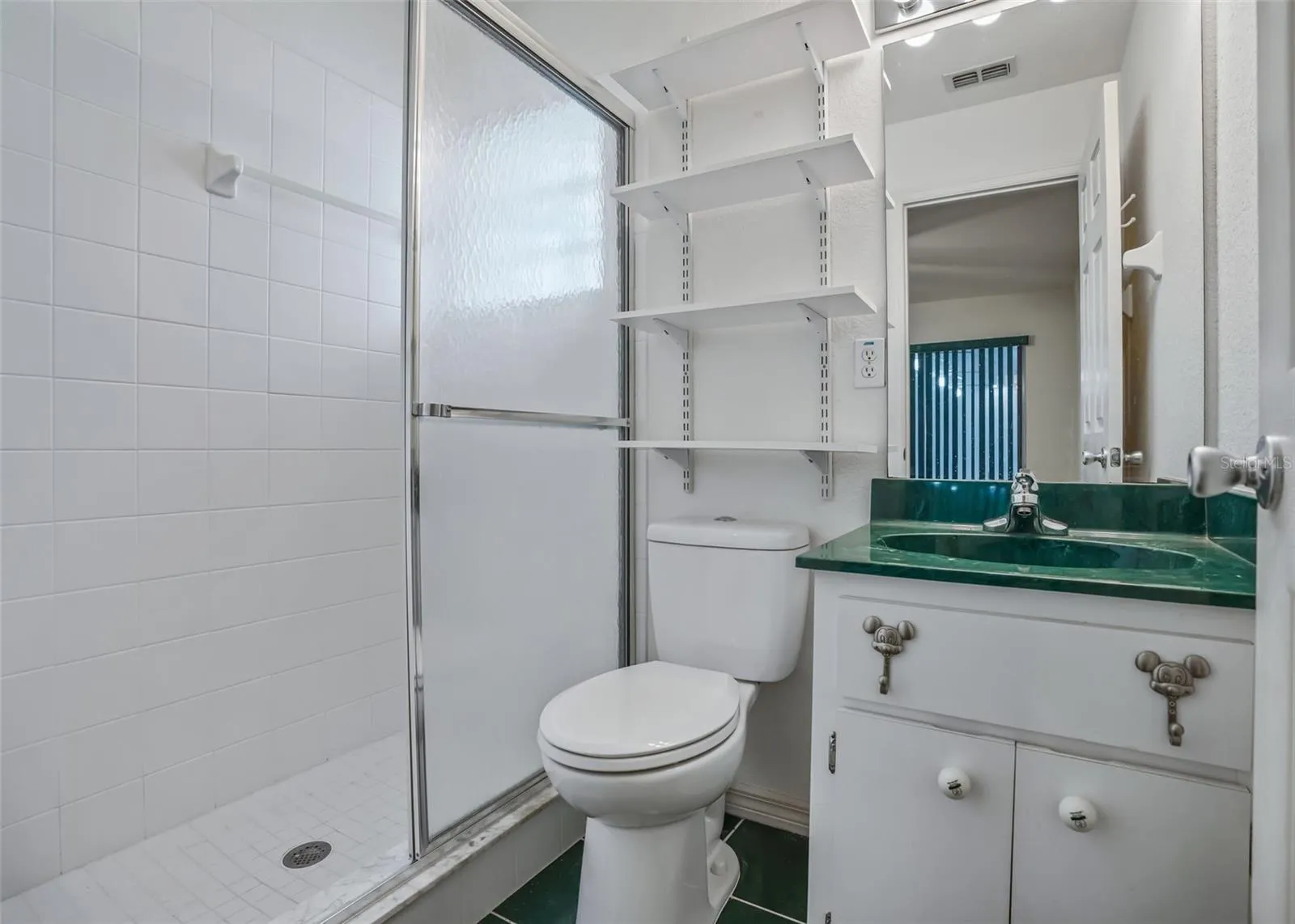 Full bathroom w/Tiled Walk in Shower in Cassita