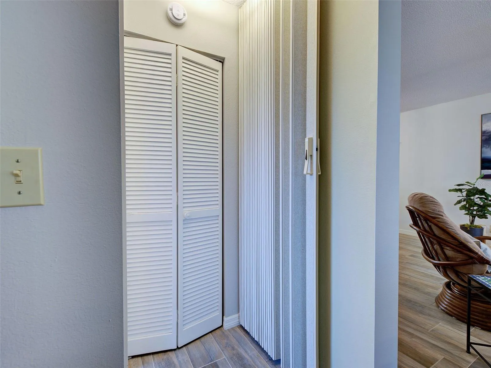 The wall is out of the way when not in use.  There is also a linen closet for extra storage