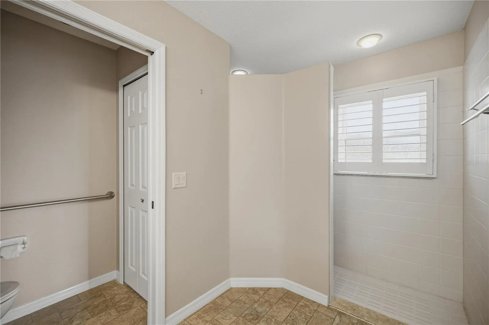 Primary bathroom with walk-in shower and private water closet