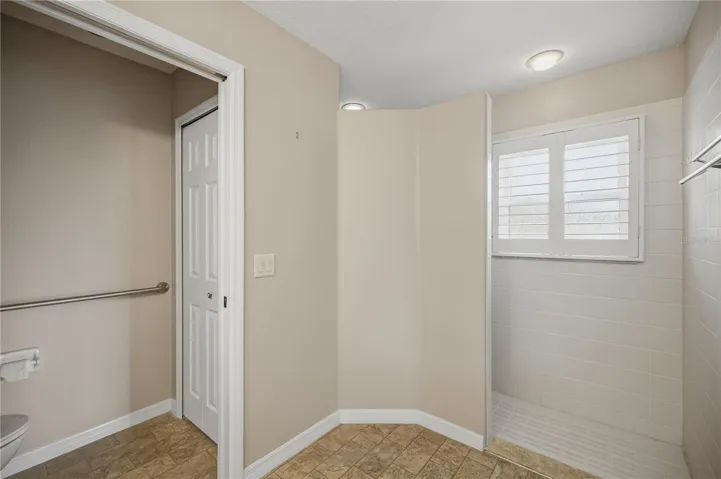 Primary bathroom with walk-in shower and private water closet