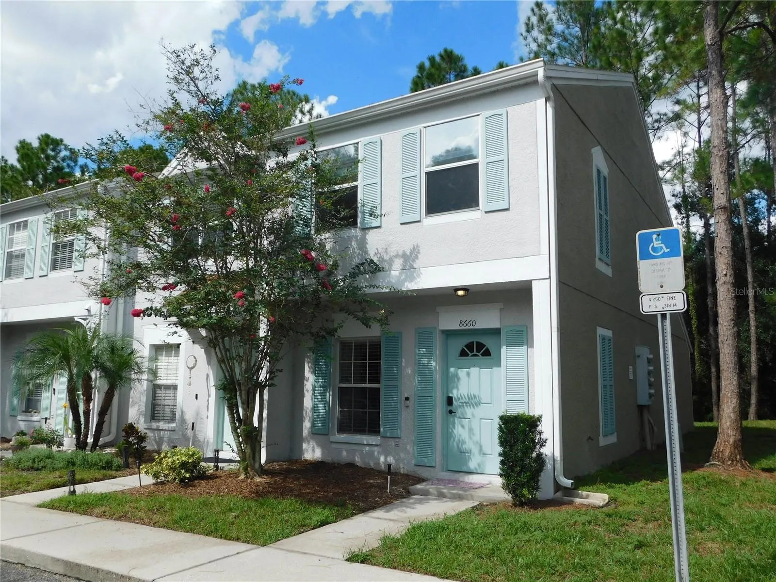 Corner Unit with reserved parking space in front.