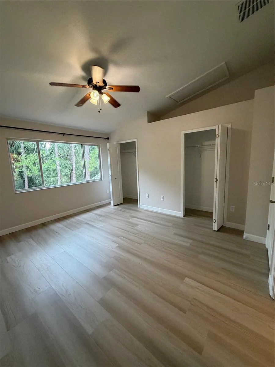 Primary 1  LVP Flooring - conservation view - Dual Closets - Vaulted ceiling - Remodeled adjoining bathroom