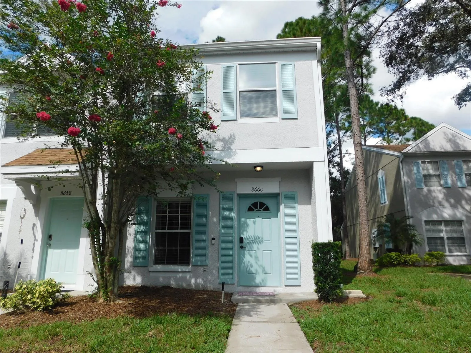 Corner Unit with reserved parking space in front.