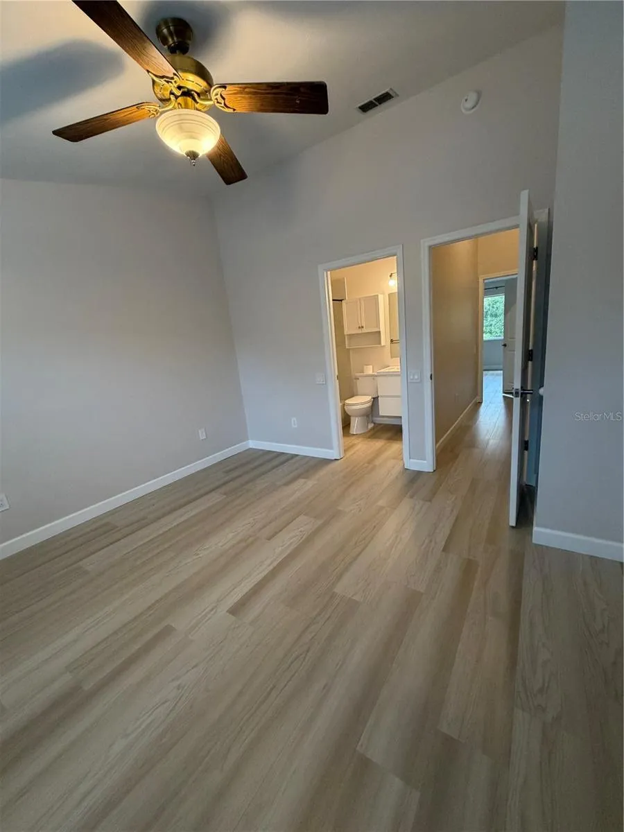 Primary 2 LVP Flooring - Vaulted ceiling - Remodeled adjoining bathroom