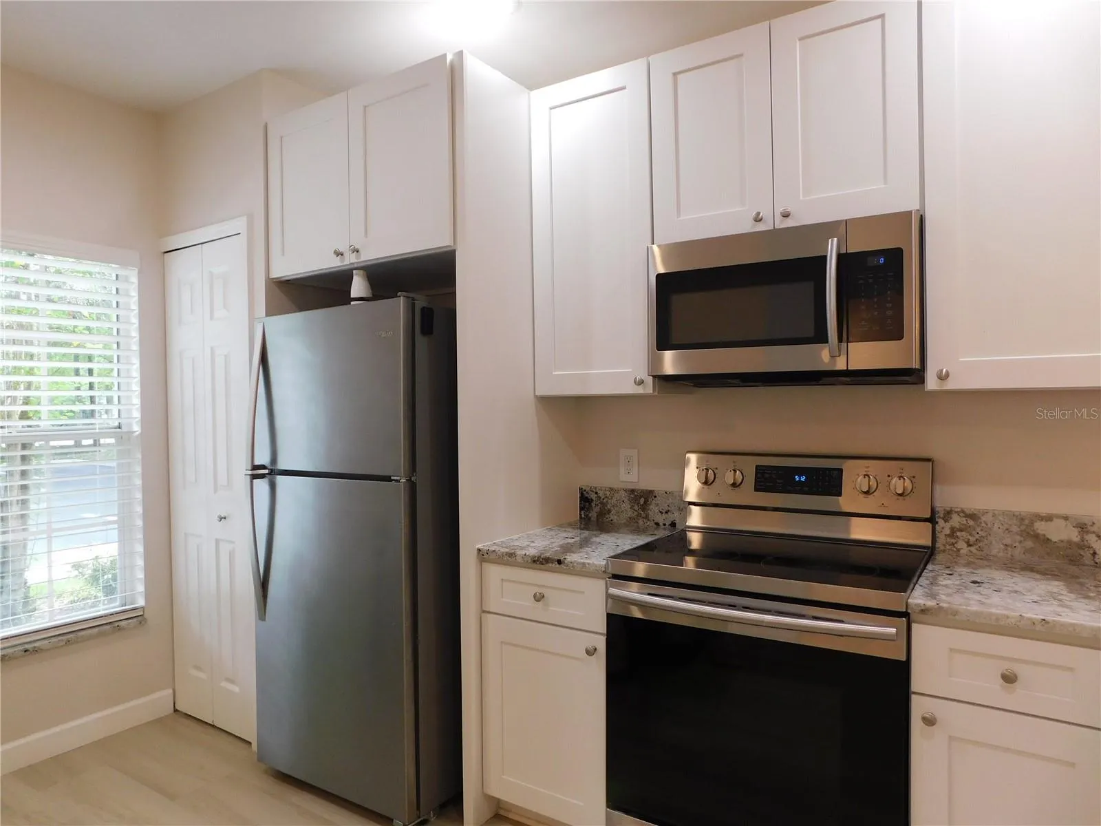 Remodeled Kitchen with new cabinets, gorgeous Granite counters and large ss deep sink.