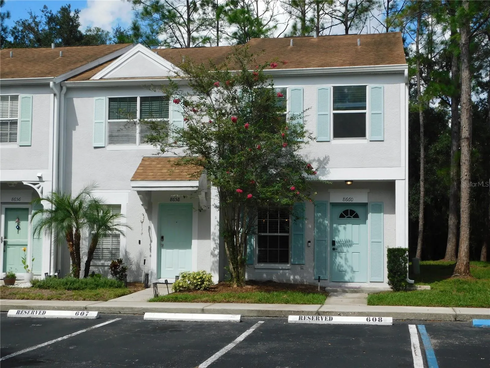 Corner Unit with reserved parking space in front.