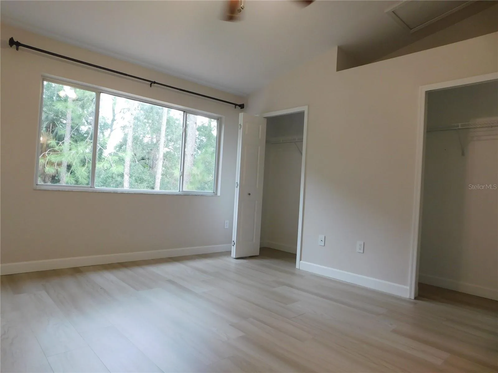 Primary 1  LVP Flooring - conservation view - Dual Closets - Vaulted ceiling - Remodeled adjoining bathroom