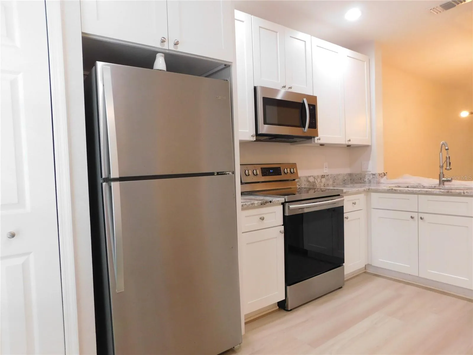 Remodeled Kitchen with new cabinets, gorgeous Granite counters and large ss deep sink.