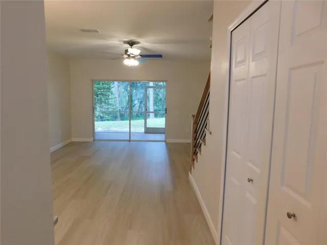 Living Area features new modern LVP and new Wood stairs for a modern finish