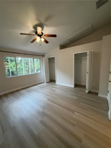 Primary 1  LVP Flooring - conservation view - Dual Closets - Vaulted ceiling - Remodeled adjoining bathroom