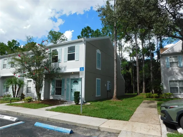 Corner Unit with reserved parking space in front.
