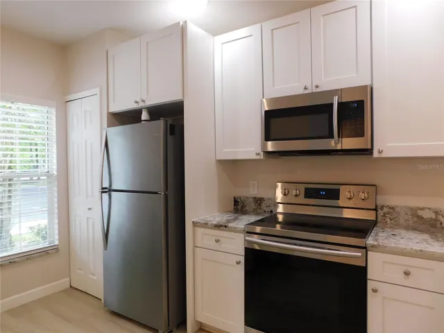 Remodeled Kitchen with new cabinets, gorgeous Granite counters and large ss deep sink.