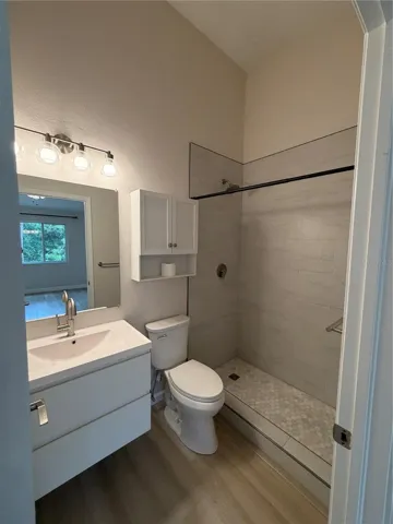 Primary 1 New Remodel Ensuite - Flooring, Shower tiles, Vanity and Faucet, Mirror, Toilet and Light Fixture.