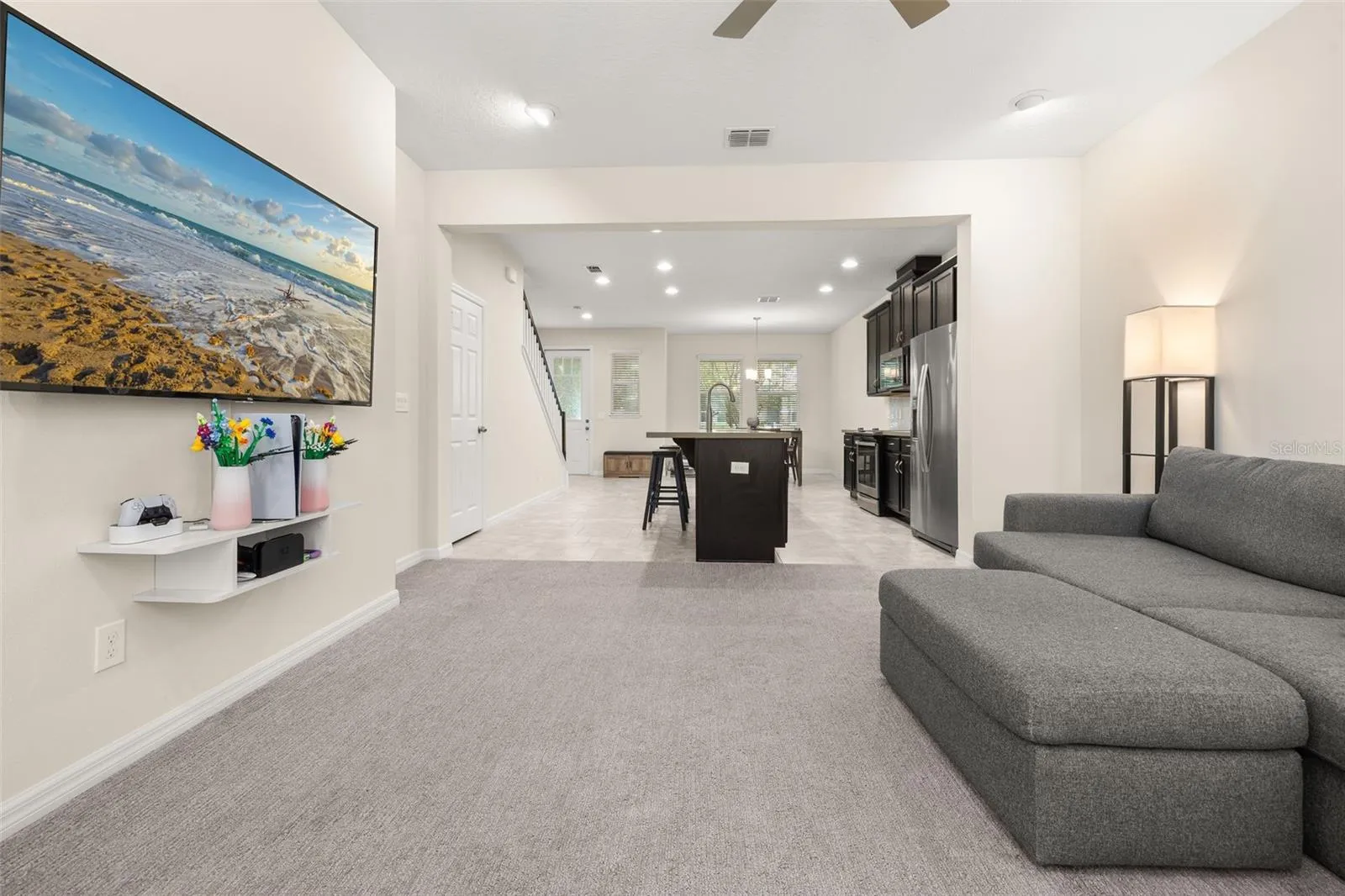 View of the entire downstairs living space from the back of the home