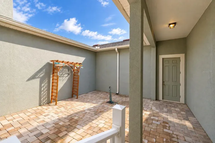 House and garage connected by a covered walkway