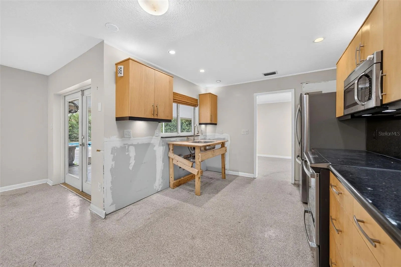 Plumbing leak repaired, cabinets removed. Build your own dream kitchen.