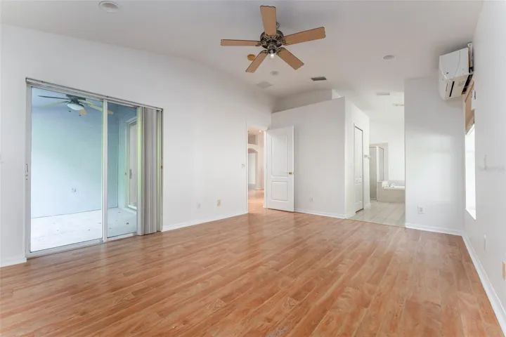 Sliding glass doors to back patio in primary